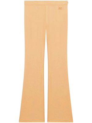 Courrèges pantalon évasé à logo brodé - Tons neutres
