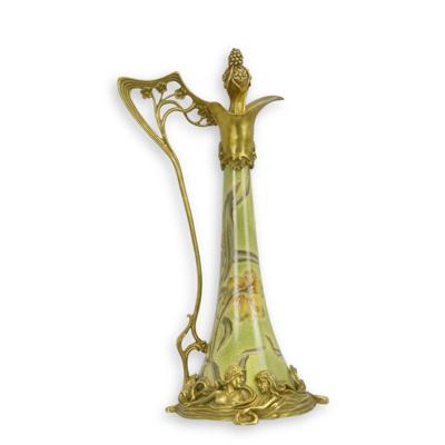 A BRONZE MOUNTED PORCELAIN CLARET JUG