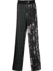 Roberto Cavalli pantalon de jogging en soie à imprimés multiples - Noir