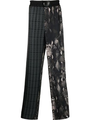 Roberto Cavalli pantalon de jogging en soie à imprimés multiples - Noir
