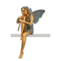 A BRONZE SCULPTURE OF A STTING FAIRY PLAYING FLUTE A BRONZE SCULPTURE OF A STTING FAIRY PLAYING FLUTE