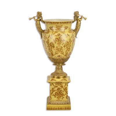 A BRONZE MOUNTED PORCELAIN URN ON BASE