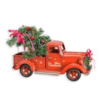 A TIN MODEL OF A PICK UP TRUCK IN CHRISTMAS STYLE