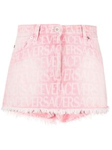 Versace minijupe en jean à motif monogrammé - Rose