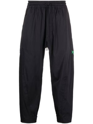 Y-3 pantalon de jogging fuselé à logo imprimé - Noir