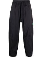 Y-3 pantalon de jogging fuselé à logo imprimé - Noir
