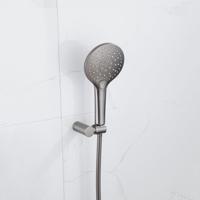 Fortifura Calvi Thermostatische badkraan met ronde handdouche, handdouchehouder en metalen doucheslang Geborsteld Gunmetal PVD SW799451/SW720568/SW720225/SW706207