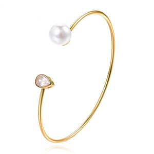 Goudkleurige armband met Ovale Zirkonia Steen en Imitatie Parel