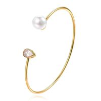 Goudkleurige armband met Ovale Zirkonia Steen en Imitatie Parel