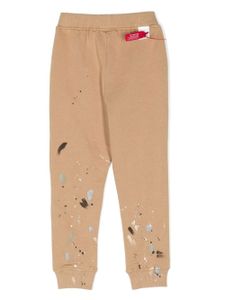 Mostly Heard Rarely Seen 8-Bit pantalon de jogging à effet taches de peinture - Marron