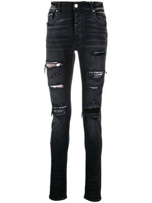 AMIRI jean slim à effet usé - Noir