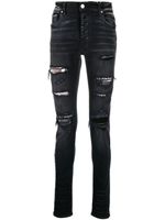 AMIRI jean slim à effet usé - Noir
