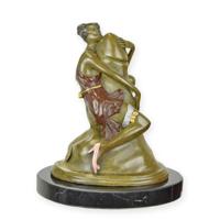 A BRONZE SCULPTURE OF A WOMAN EMBRACING A PHALLUS - thumbnail