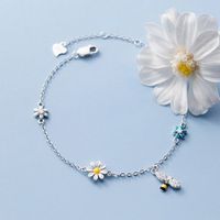 Zilveren Armband met Madelief Bloemen en Bijen Bedels - Sieraden - Spiritueelboek.nl - thumbnail