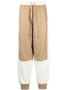 JW Anderson pantalon de jogging fuselé à design colour block - Marron