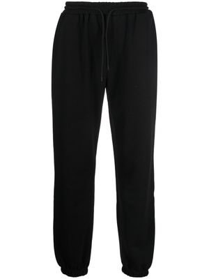 MSGM pantalon de jogging en coton à logo imprimé - Noir