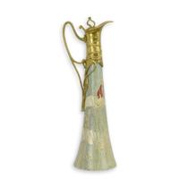 A BRONZE MOUNTED PORCELAIN CLARET JUG