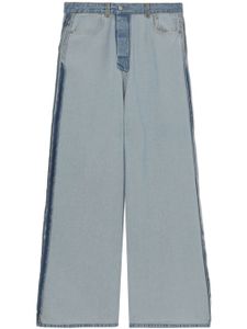 VETEMENTS jean ample à finitions effilochées - Bleu