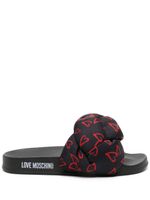 Love Moschino claquettes à cœurs imprimés - Noir