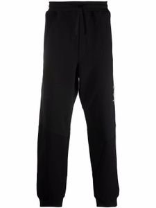 Valentino Garavani pantalon de jogging à imprimé VLTN - Noir