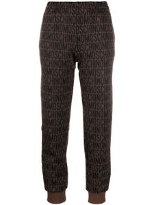 Moschino pantalon de jogging à motif monogrammé - Marron