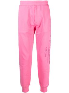 Alexander McQueen pantalon de jogging à logo imprimé - Rose