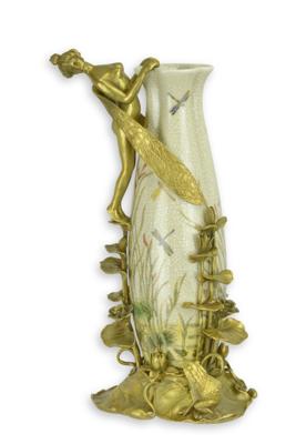 A BRONZE MOUNTED PORCELAIN VASE