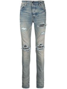 AMIRI jean skinny MX1 à effet usé - Bleu