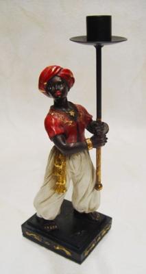A RESIN VASSAL CANDLE HOLDER