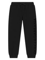 Dolce & Gabbana Kids logo-flocked cotton track pants - Noir