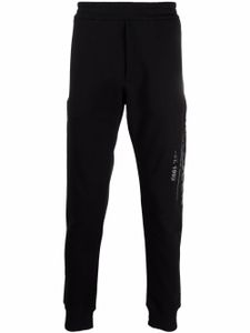 Alexander McQueen pantalon de jogging à logo imprimé - Noir