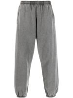 Acne Studios pantalon de jogging à bords frangés - Gris - thumbnail