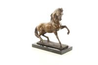 A BRONZE SCULPTURE OF A STALLION A BRONZE SCULPTURE OF A STALLION