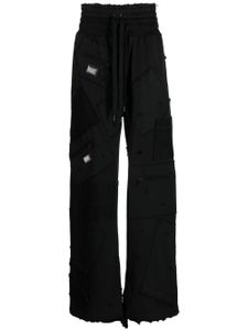 Dolce & Gabbana pantalon de jogging à design patchwork - Noir