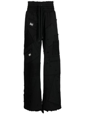 Dolce & Gabbana pantalon de jogging à design patchwork - Noir