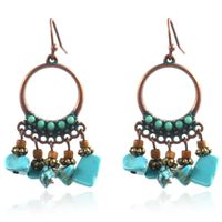 Ronde dames oorbellen met hangers en turquoise steentjes - thumbnail
