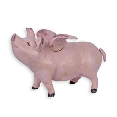 A CAST IRON FLYING PIG BANK, PINK
