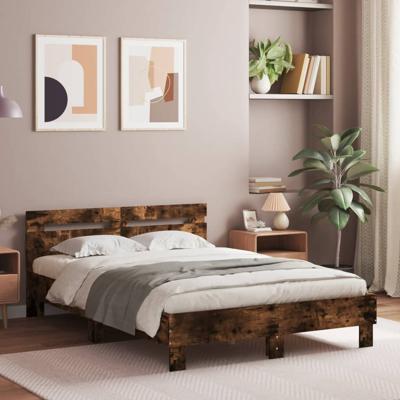 Bedframe met hoofdeinde en LED gerookt eikenkleurig 135x190 cm