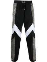 Balmain pantalon de jogging à bandes monogrammées - Noir Balmain pantalon de jogging à bandes monogrammées - Noir