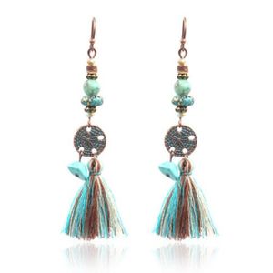 Bronzen oorhangers met muntje, kwastje en turquoise stenen