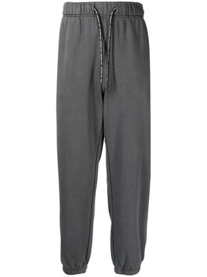 AAPE BY *A BATHING APE® pantalon de jogging à logo imprimé - Gris AAPE BY *A BATHING APE® pantalon de jogging à logo imprimé - Gris