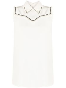 Miu Miu Pre-Owned blouse sans manches à détail de plastron - Blanc