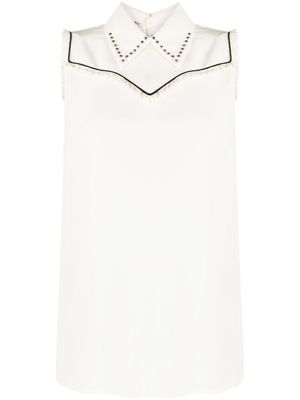 Miu Miu Pre-Owned blouse sans manches à détail de plastron - Blanc