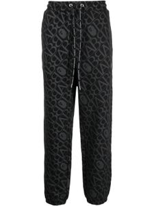 A BATHING APE® pantalon de jogging à imprimé monogrammé - Noir