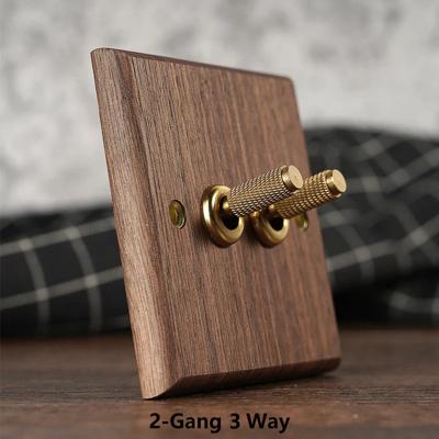 RetroLux Zwart Walnoot 1-4 Gang Wandschakelaar met Messing Toggle