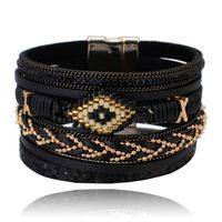 Zwarte dames armband met kristal en goudkleurige details - thumbnail