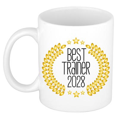 Cadeau koffie/thee mok - de beste trainer van 2028 - wit - 300 ml - keramiek