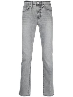 FRAME jean skinny à taille basse - Gris