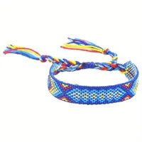 Handgemaakte geweven verstelbare armband uit Nepal met donkerblauw-lichtblauw-geel-rood motief - Sieraden - Spiritueelboek.nl