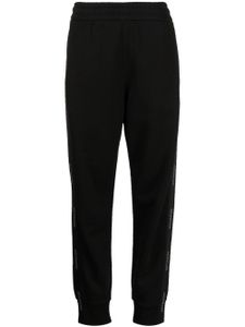 Moncler pantalon de jogging en coton à bandes logo - Noir